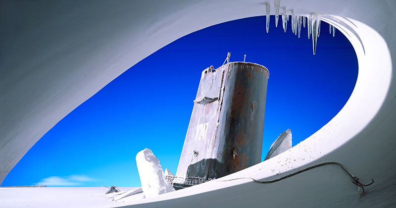 Submarine stranded in the Arctic inspired by a photo by Scott.. One shot in studio. Single exposure on 5x4 transparency film I made the icescape and Simon Cauty made the submarine.The sky was on a back projection screen.